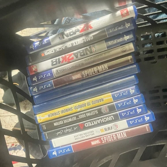 PlayStation 4 with games and two controllers
